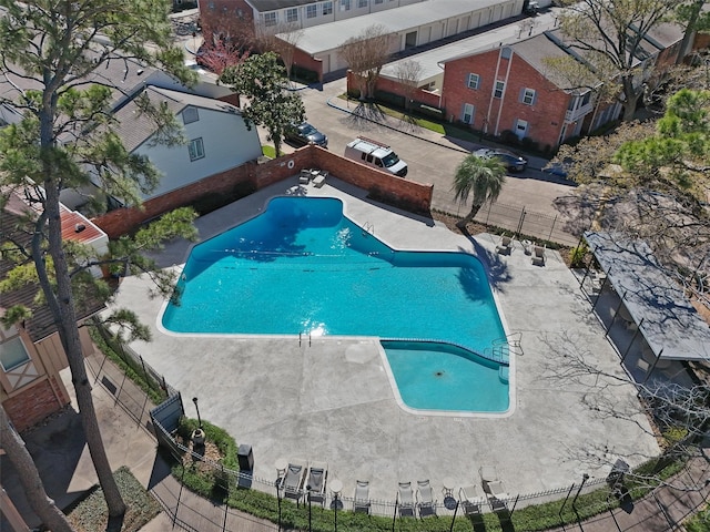 pool featuring a patio area and fence