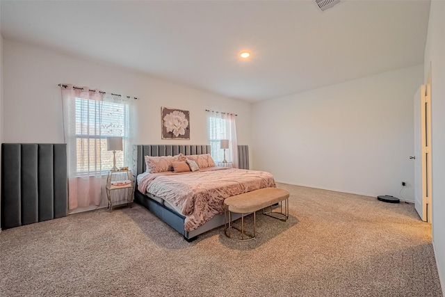 bedroom with recessed lighting, baseboards, and carpet