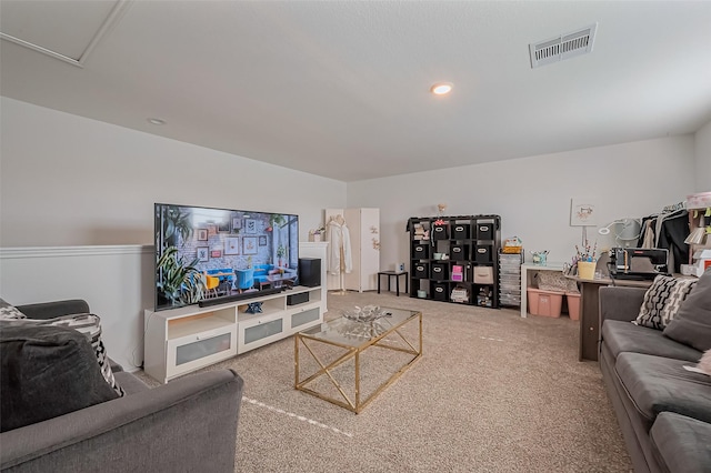 carpeted living room with recessed lighting and visible vents