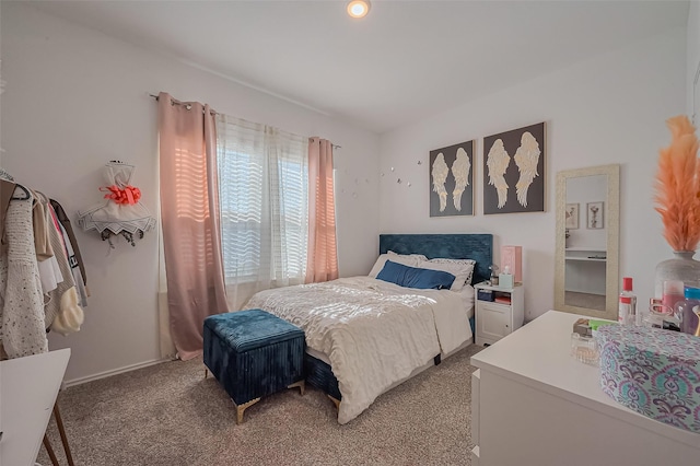 bedroom featuring light colored carpet