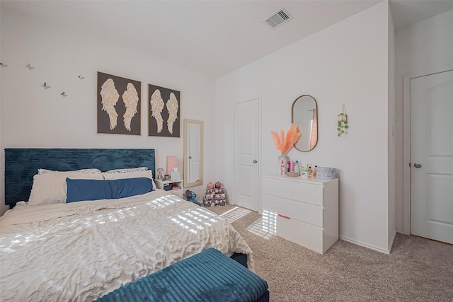 carpeted bedroom with visible vents