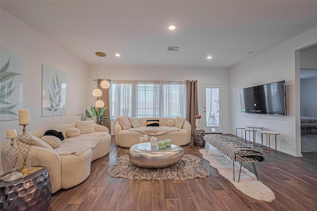 living room with visible vents, recessed lighting, baseboards, and wood finished floors