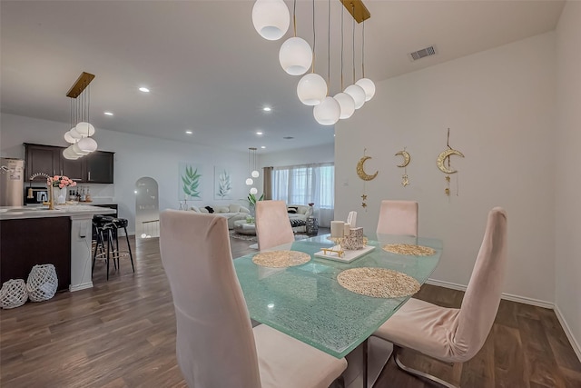 dining space featuring recessed lighting, dark wood-style floors, visible vents, and baseboards