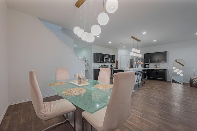 dining room with stairs, recessed lighting, dark wood finished floors, and baseboards