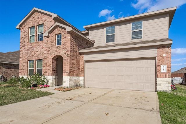 traditional-style house with brick siding, driveway, and a garage