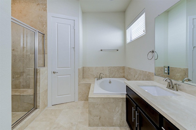 bathroom featuring tile patterned floors, a shower stall, vanity, and a garden tub