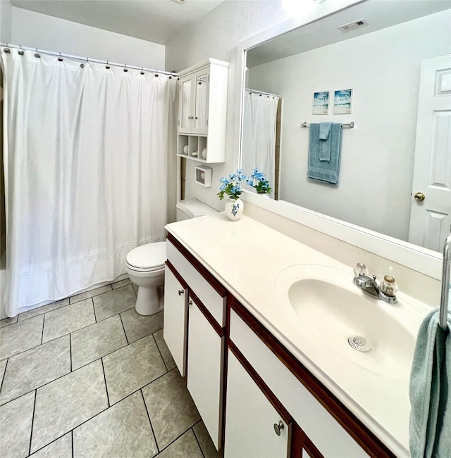 full bathroom with visible vents, a shower with shower curtain, toilet, tile patterned floors, and vanity