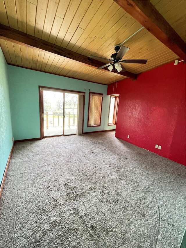 carpeted empty room with ceiling fan, a textured wall, beamed ceiling, and wooden ceiling