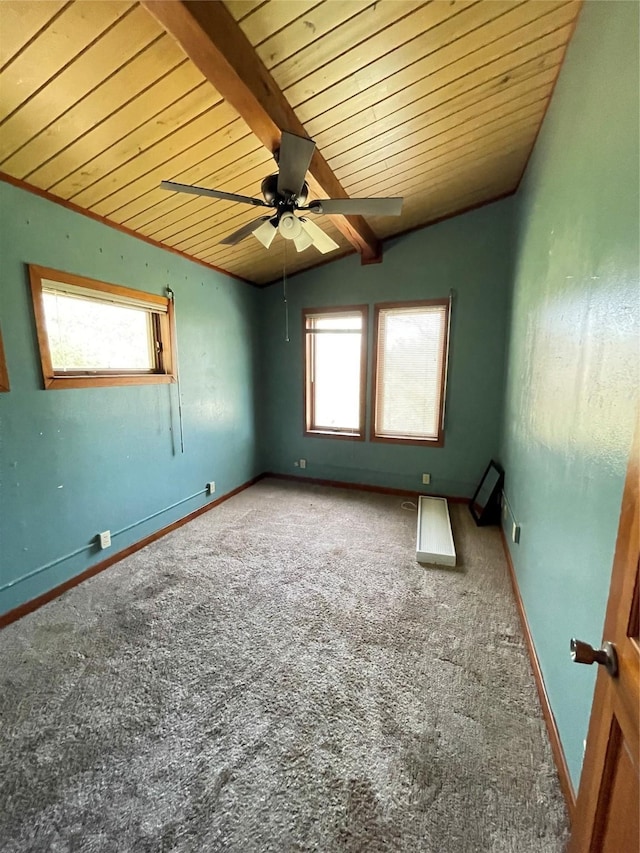 carpeted empty room with vaulted ceiling with beams, wood ceiling, baseboards, and ceiling fan