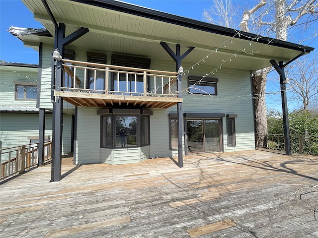 rear view of property with a balcony