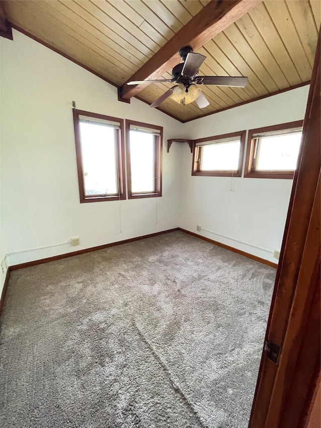 unfurnished room featuring baseboards, wood ceiling, ceiling fan, vaulted ceiling with beams, and carpet flooring