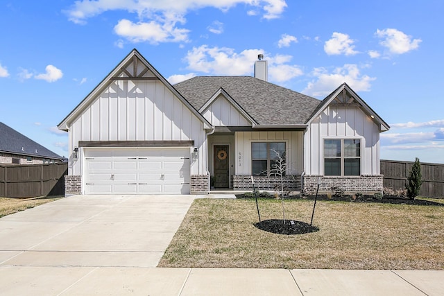 modern farmhouse featuring concrete driveway, brick siding, board and batten siding, and fence