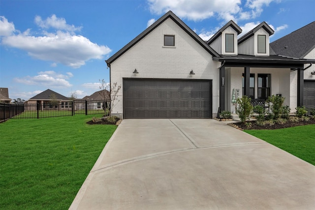 view of front of property featuring a front yard, concrete driveway, fence, and brick siding