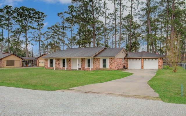 ranch-style home with a front yard, driveway, an attached garage, and fence