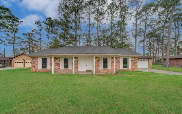 ranch-style house featuring a garage, concrete driveway, brick siding, and a front yard