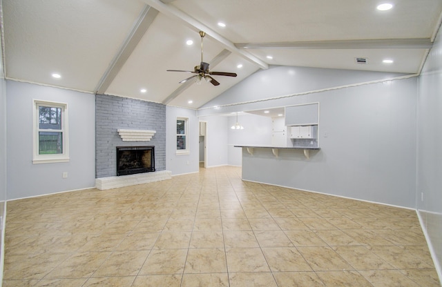 unfurnished living room featuring ceiling fan, light tile patterned floors, vaulted ceiling with beams, recessed lighting, and a brick fireplace