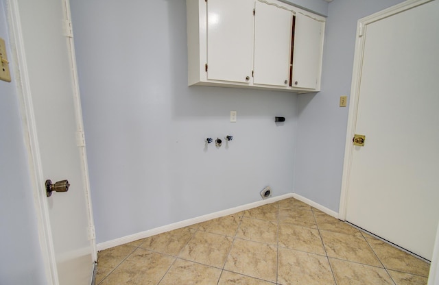 washroom featuring cabinet space, light tile patterned floors, baseboards, hookup for a washing machine, and electric dryer hookup