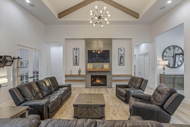 living room featuring beam ceiling, a fireplace, french doors, wood finished floors, and high vaulted ceiling