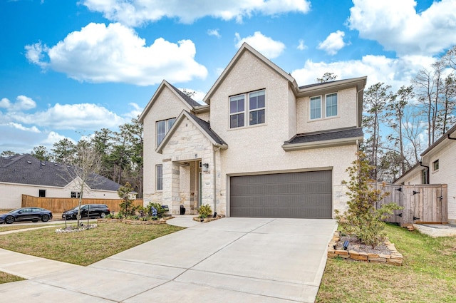 traditional home featuring driveway, stone siding, an attached garage, fence, and a front yard