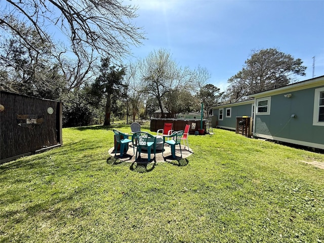 view of yard featuring an outdoor fire pit