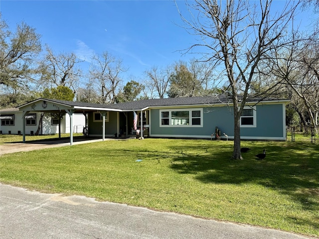 single story home featuring driveway, a front lawn, and a carport