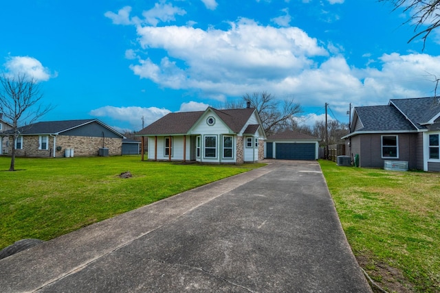 view of front of home featuring a garage, central AC, a front lawn, and an outdoor structure