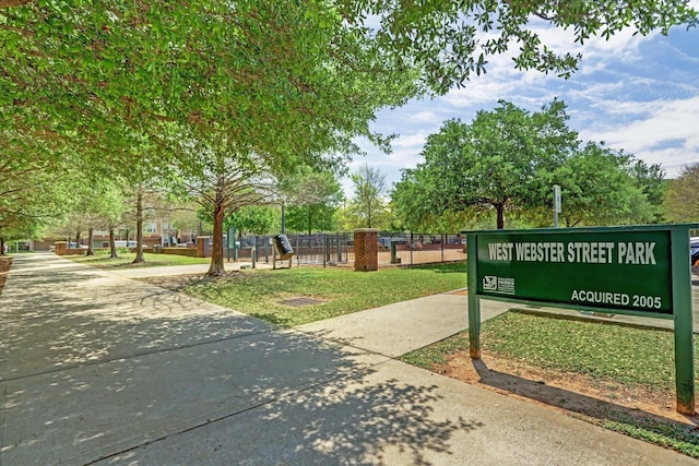 view of community featuring fence