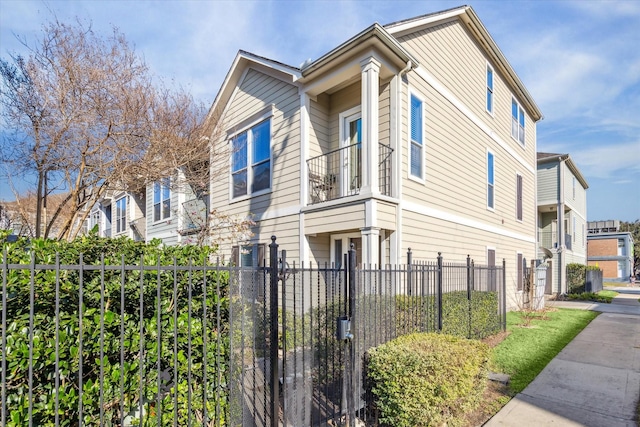 view of side of home featuring a fenced front yard