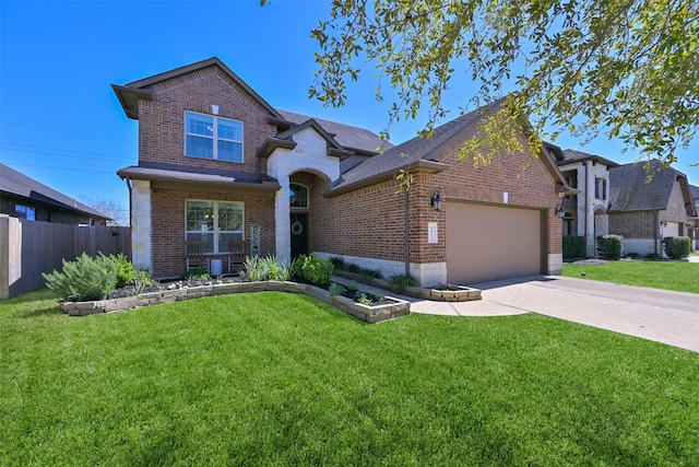 view of front of property with a front yard, brick siding, driveway, and fence