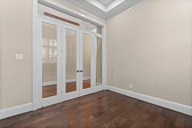 unfurnished room featuring dark wood-style floors, baseboards, and french doors