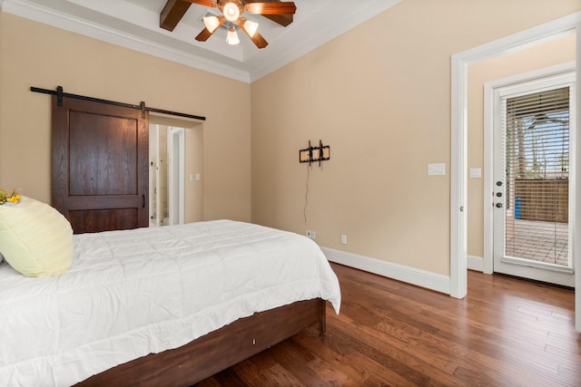 bedroom featuring a barn door, baseboards, ornamental molding, wood finished floors, and access to outside