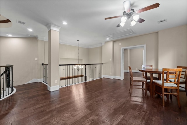 dining space with baseboards, visible vents, and wood finished floors