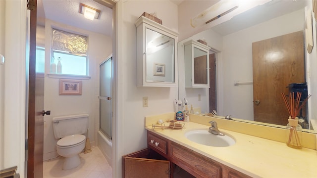 full bathroom with toilet, tile patterned flooring, enclosed tub / shower combo, and vanity