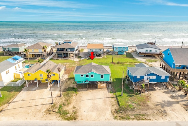 411 Seashell Dr, Surfside Beach, TX 77541 - drone / aerial view with a residential view, a view of the beach, and a water view