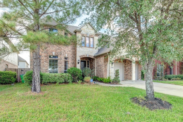 view of front of property featuring brick siding, an attached garage, stone siding, driveway, and a front lawn