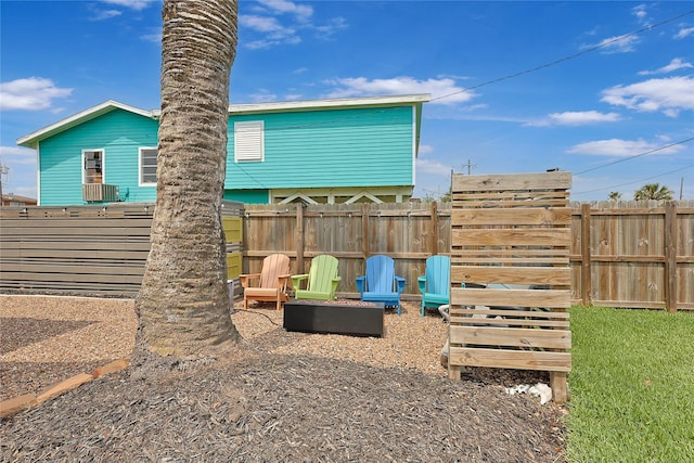 view of playground with fence and a fire pit