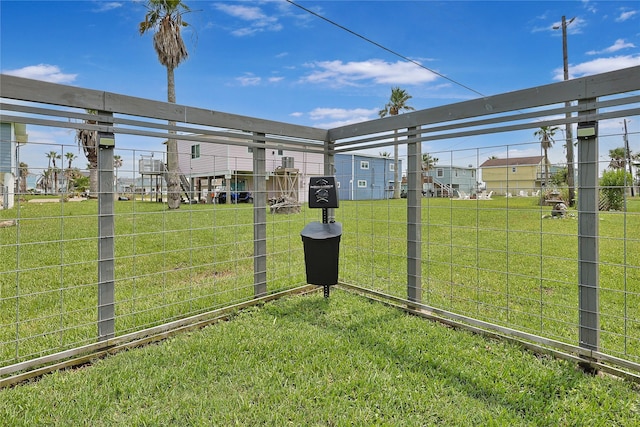 view of yard featuring a residential view and fence