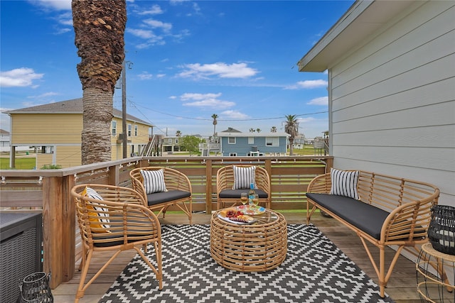 wooden deck with a residential view and an outdoor hangout area