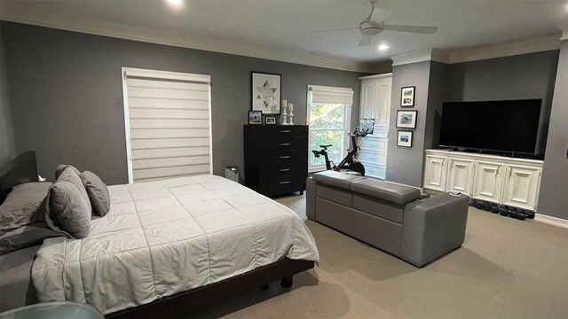 bedroom with recessed lighting, light colored carpet, a ceiling fan, baseboards, and crown molding