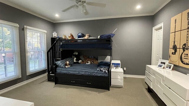 bedroom with baseboards, carpet flooring, and ornamental molding