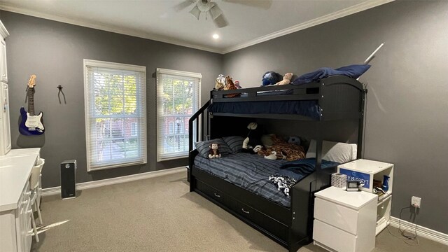 bedroom featuring light carpet, crown molding, baseboards, and ceiling fan