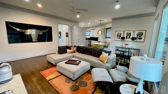 living room with recessed lighting, visible vents, baseboards, ornamental molding, and dark wood-style floors