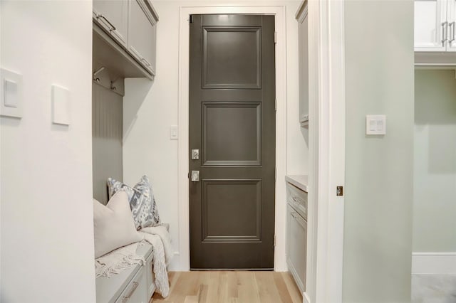 mudroom with light wood-style flooring