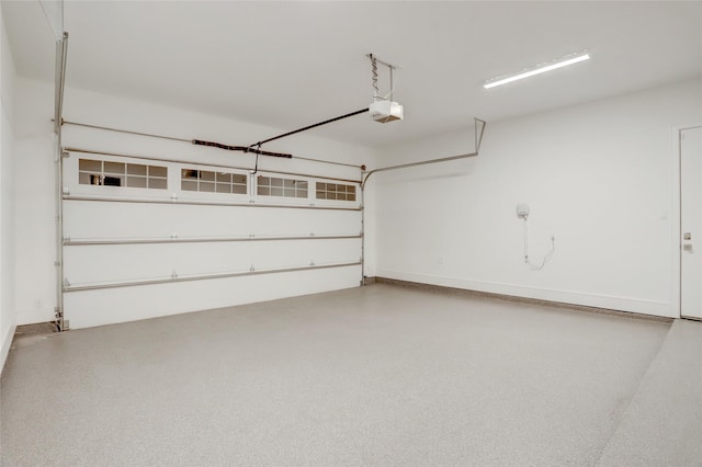 garage featuring baseboards and a garage door opener