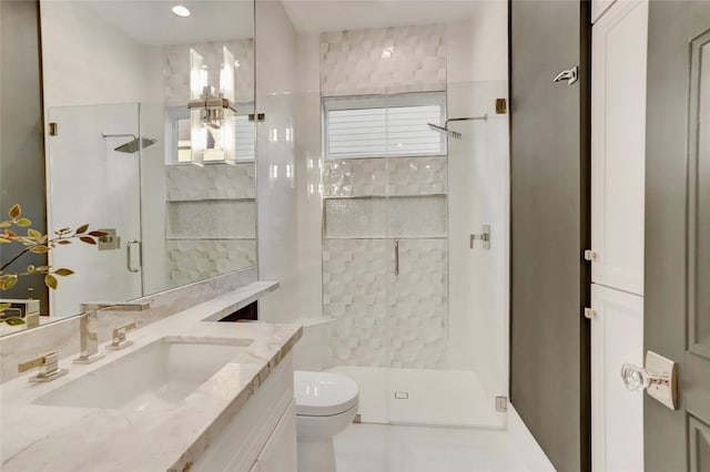 full bath with a shower stall, toilet, and vanity