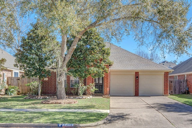 ranch-style house featuring an attached garage, driveway, fence, and brick siding