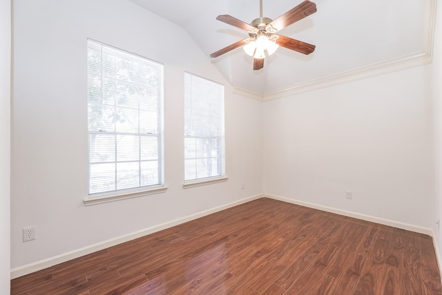 unfurnished room featuring lofted ceiling, ceiling fan, dark wood-type flooring, and baseboards