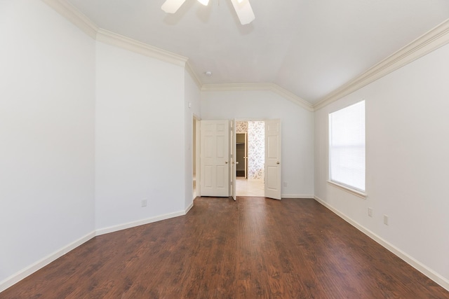 unfurnished room with dark wood-style floors, crown molding, a ceiling fan, vaulted ceiling, and baseboards