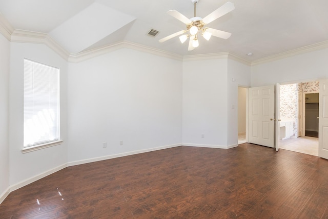 empty room with dark wood-style floors, visible vents, and crown molding