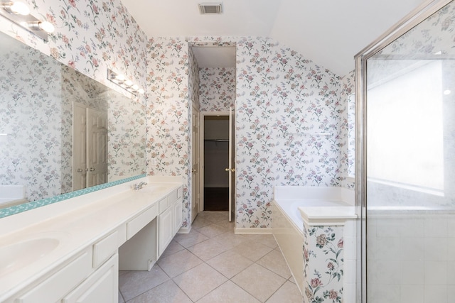 full bathroom featuring wallpapered walls, visible vents, tile patterned floors, a sink, and a bath